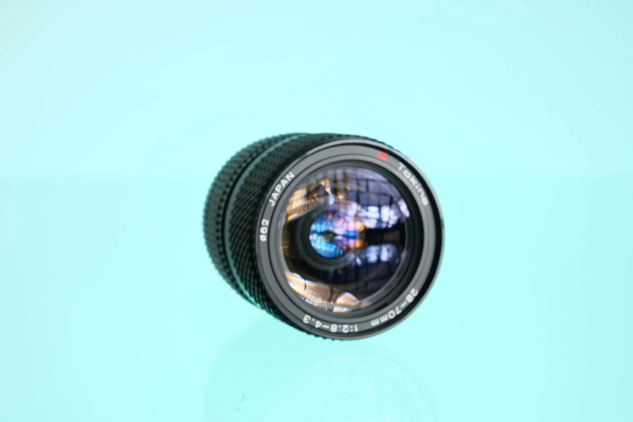 Tokina 28-70mm f/2.8-4.3 Zoom Lens Olympus OM Mount OM-10